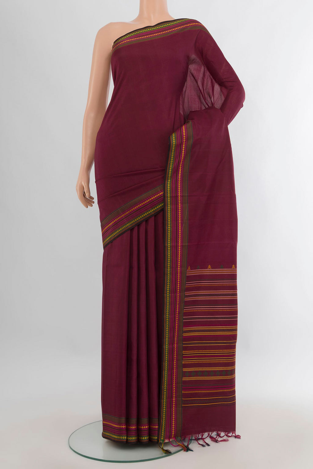 Pure Silk Maroon Kanchipuram Saree with Plain Body and Thread Border.  displayed on a mannequin