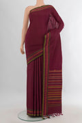 Pure Silk Maroon Kanchipuram Saree with Plain Body and Thread Border.  displayed on a mannequin