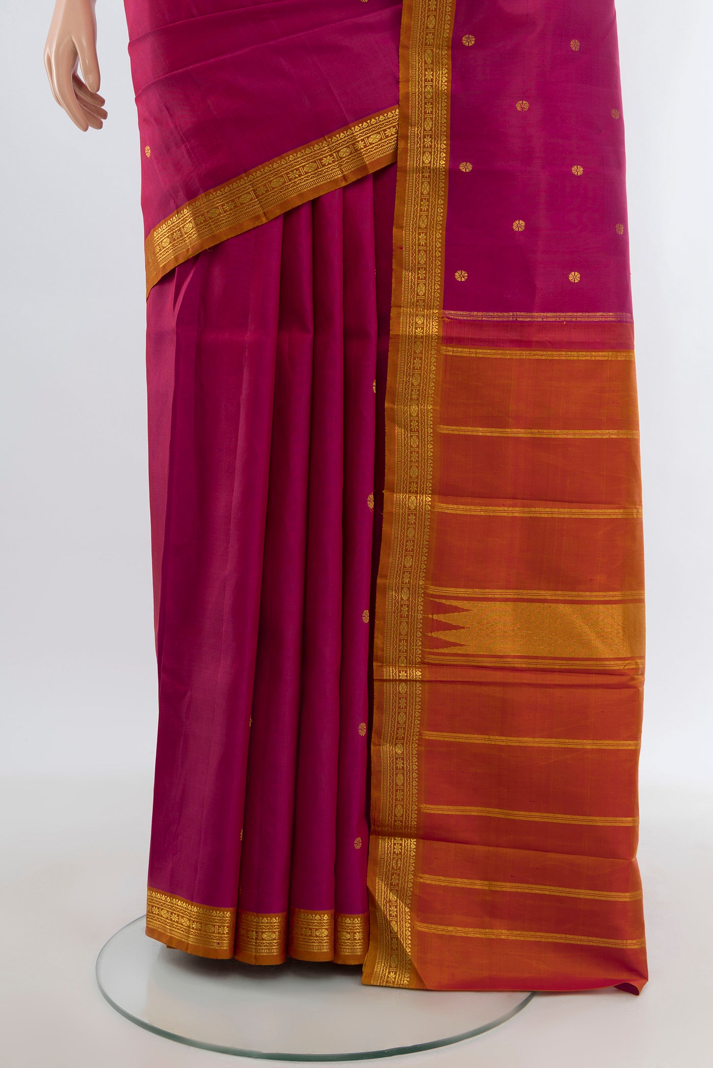 Pleats and pallu of Dark Pink Kanchipuram Silk Saree with Zari Butta on the body and Zari Border. 