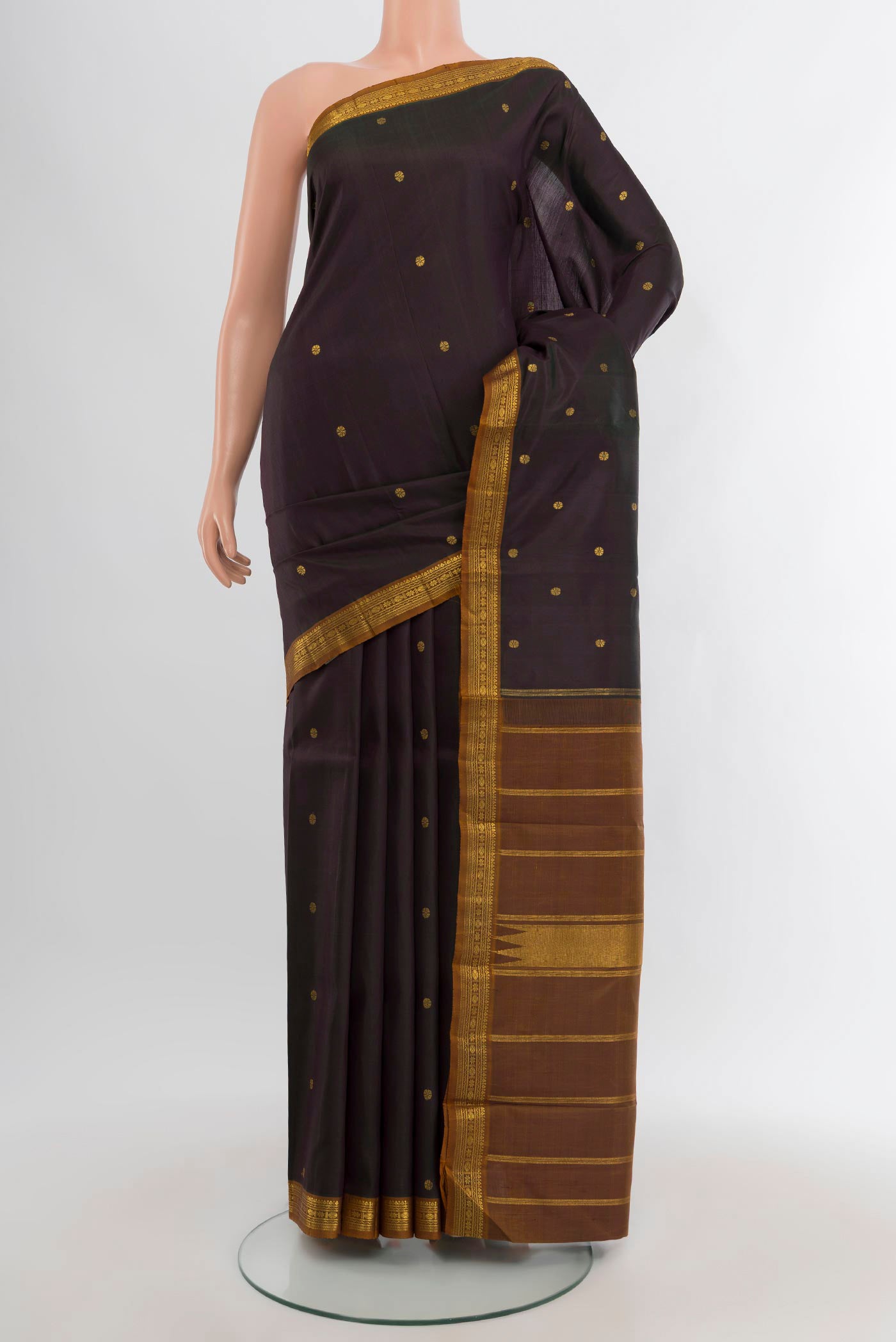 Black Kanchipuram Silk Saree with Plain Body and Zari Border.  displayed on a mannequin