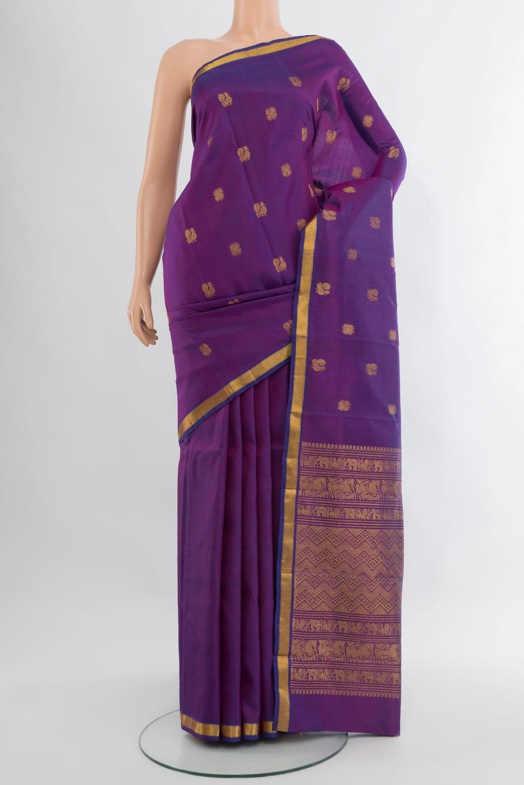 Purple Kanjivaram Silk Saree with Zari Butta on the body and Zari Border.  displayed on a mannequin