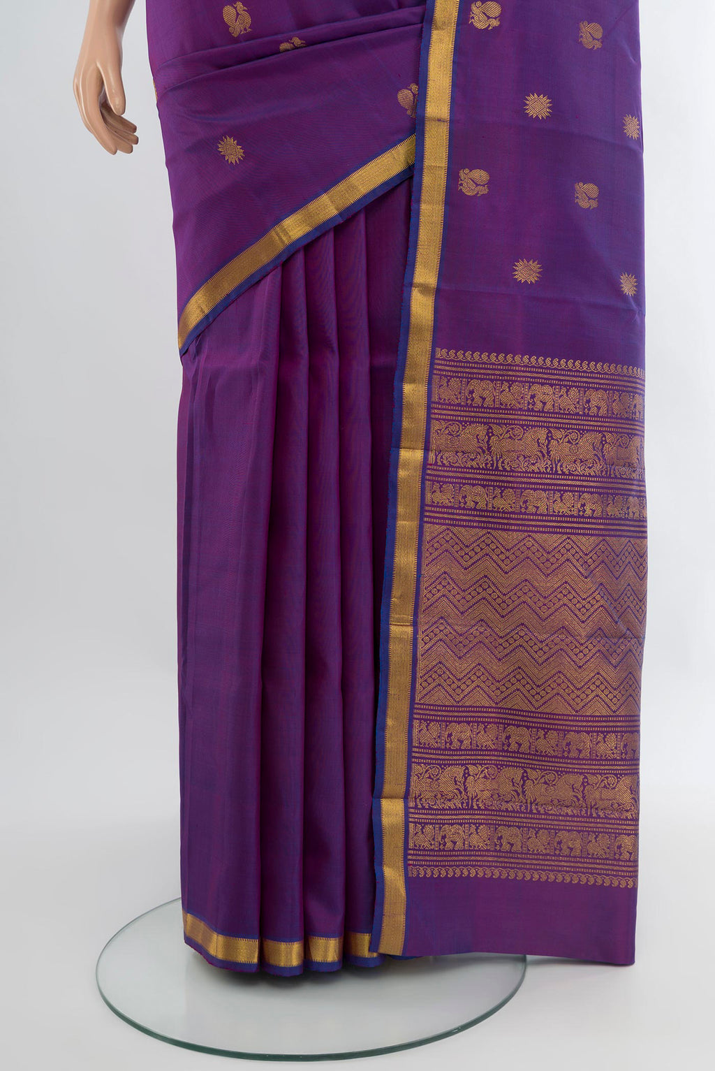 Pleats and pallu of Purple Kanjivaram Silk Saree with Zari Butta on the body and Zari Border. 