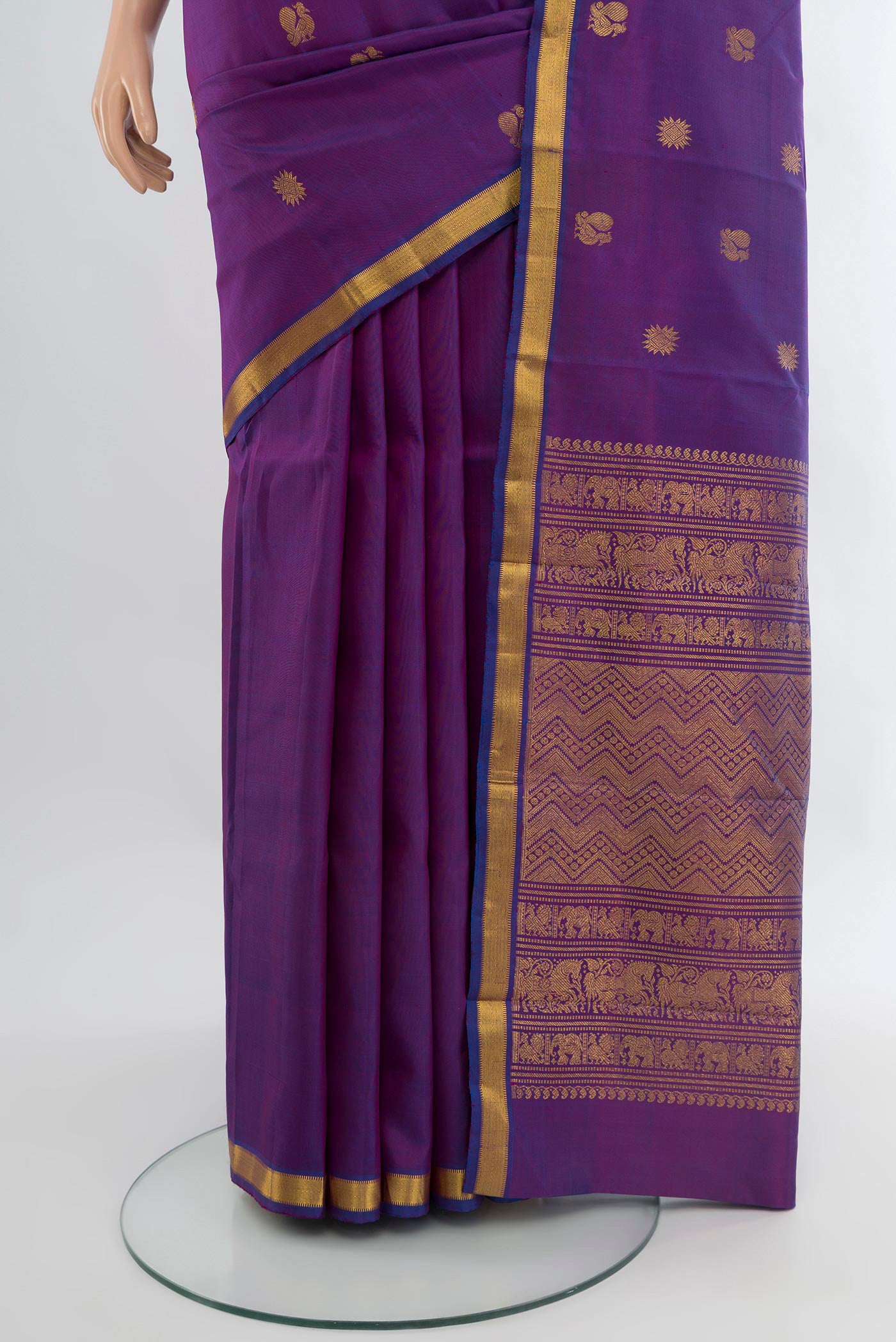 Pleats and pallu of Purple Kanjivaram Silk Saree with Zari Butta on the body and Zari Border. 