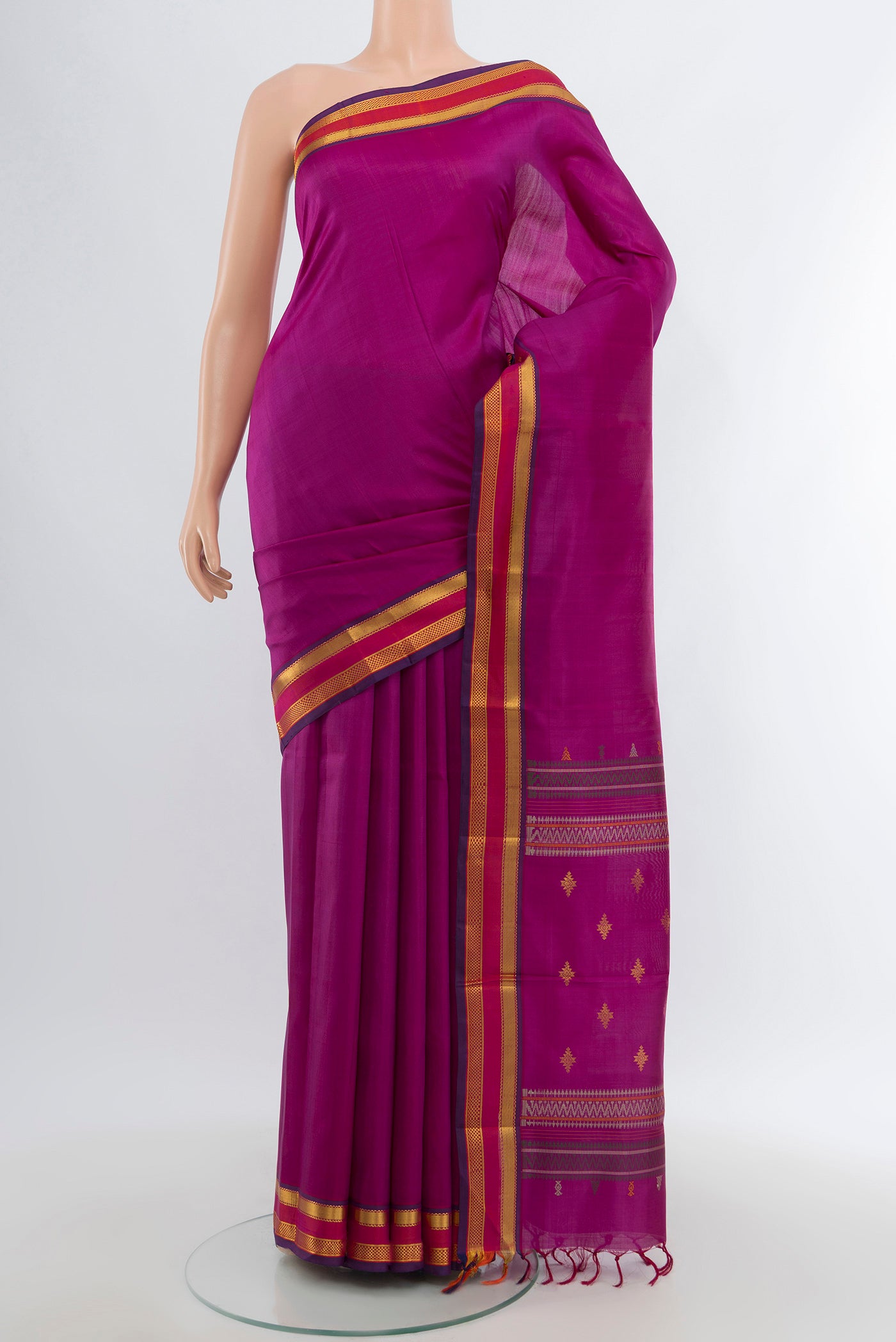 Purple Kanchipuram Silk Saree with Plain Body and Zari Border.  displayed on a mannequin