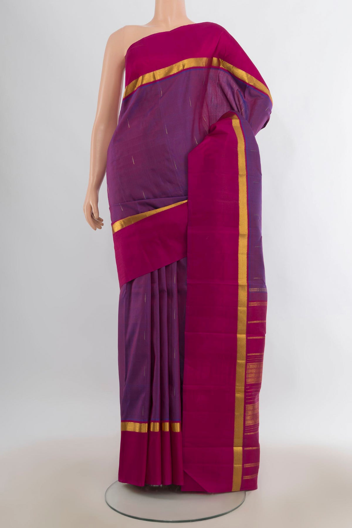 Pure Silk Purple Kanchipuram Saree with Zari Butta on the body and Zari Border.  displayed on a mannequin