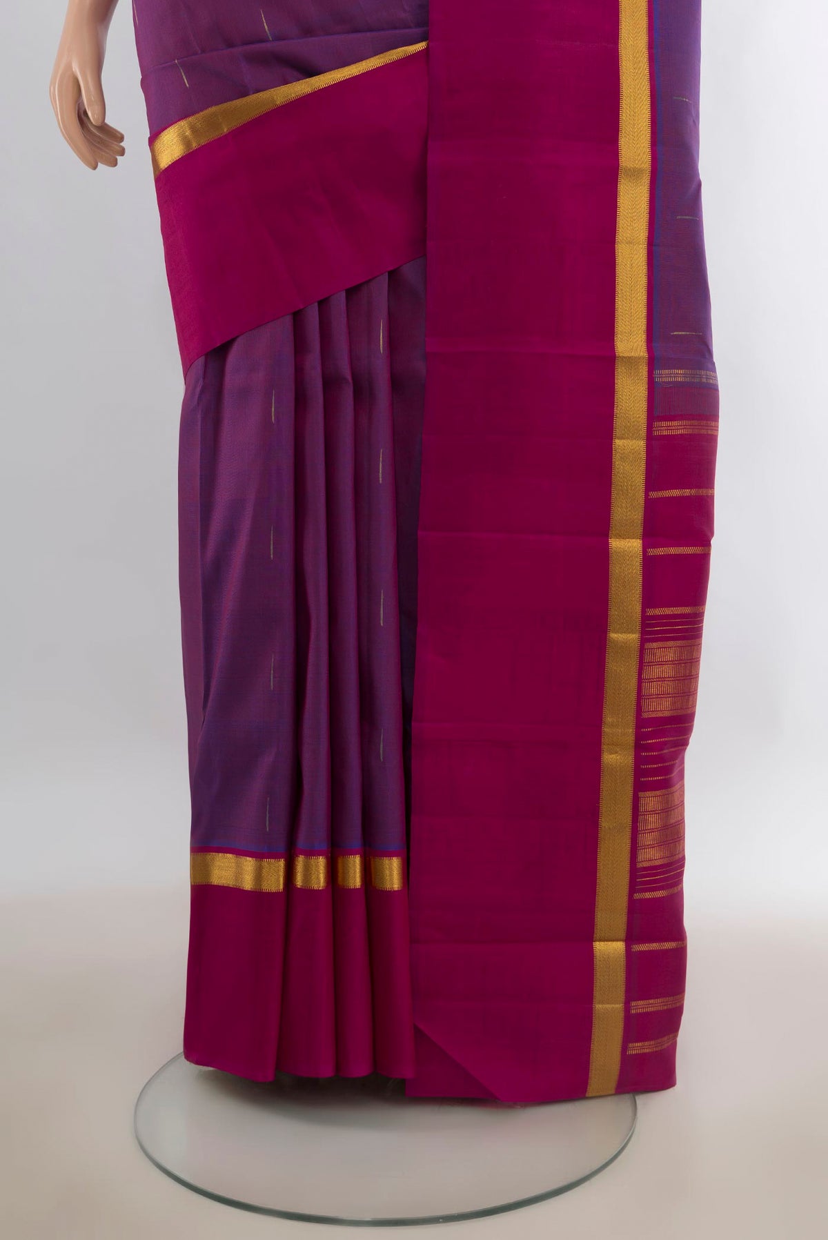 Pleats and pallu of Pure Silk Purple Kanchipuram Saree with Zari Butta on the body and Zari Border. 