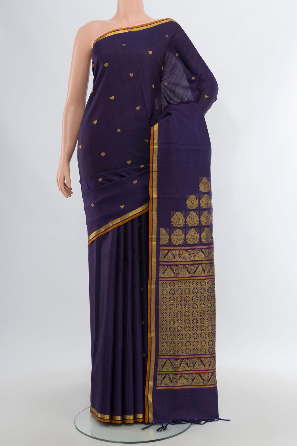 Pure Silk Pure Zari Navy Blue Kanjivaram Saree with Zari Butta on the body and Zari Border.  displayed on a mannequin