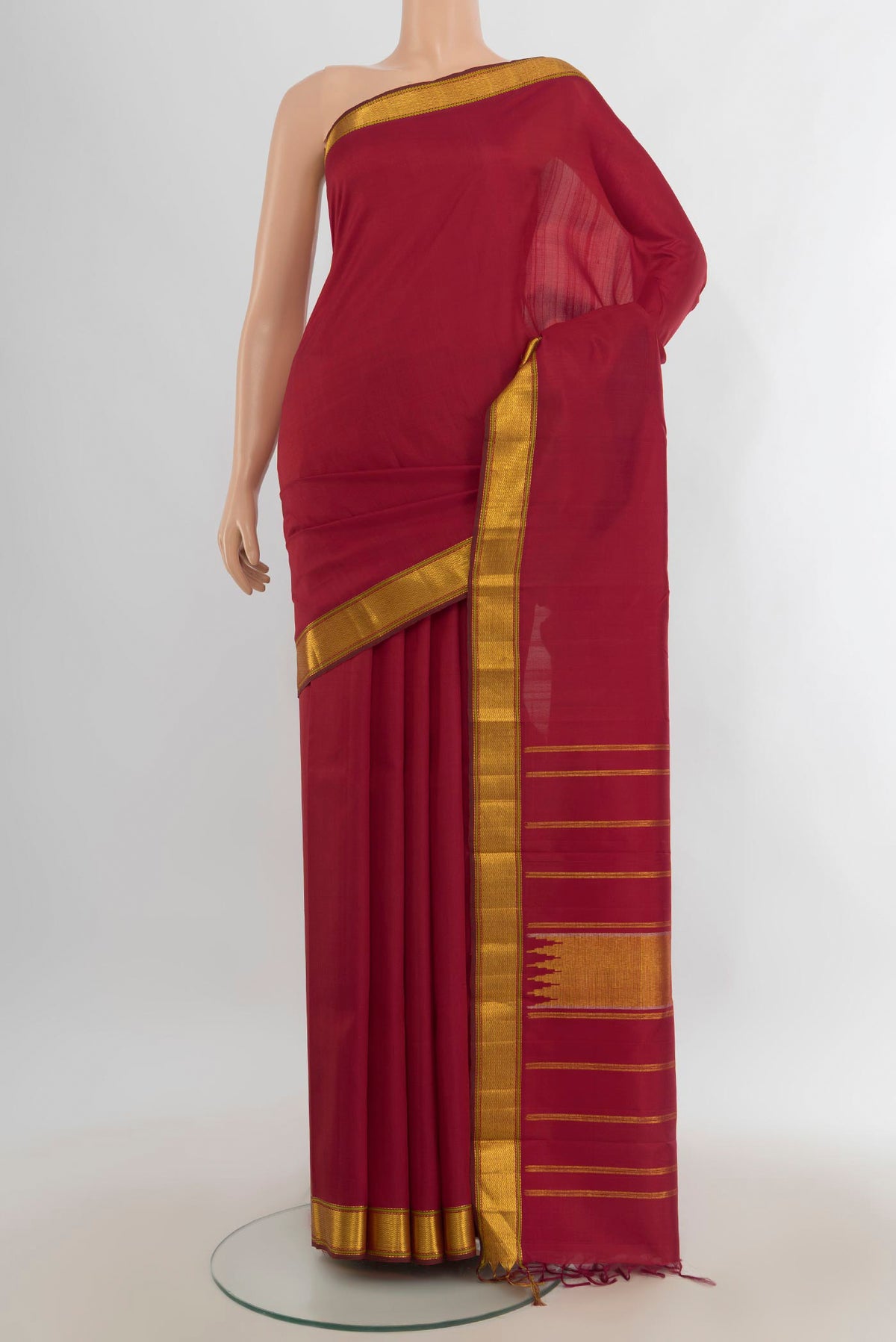 Pure Silk Pure Zari Maroon Kanchipuram Saree with Plain Body and Silk Border.  displayed on a mannequin