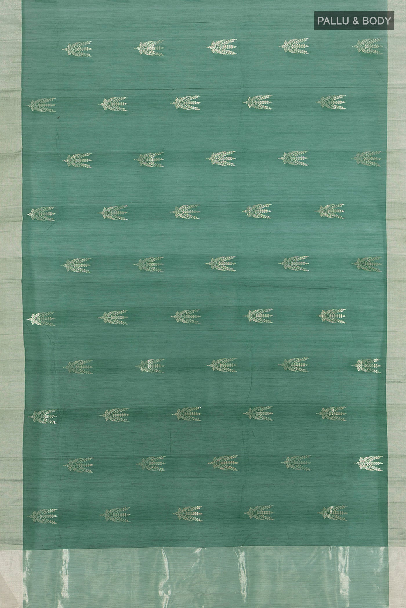 Flat view of Bottle Green Chanderi Silk Cotton Saree with Zari Butta on the body and Zari Border. 