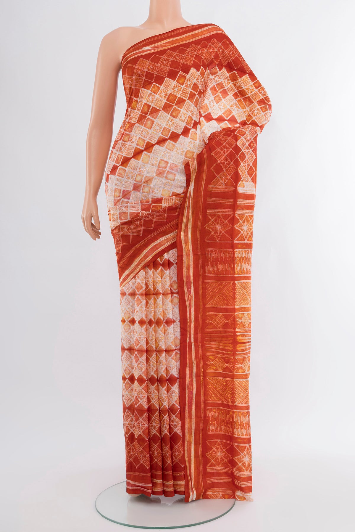 Cream Tussar Silk Saree with Floral Print on the body and Printed Border.  displayed on a mannequin