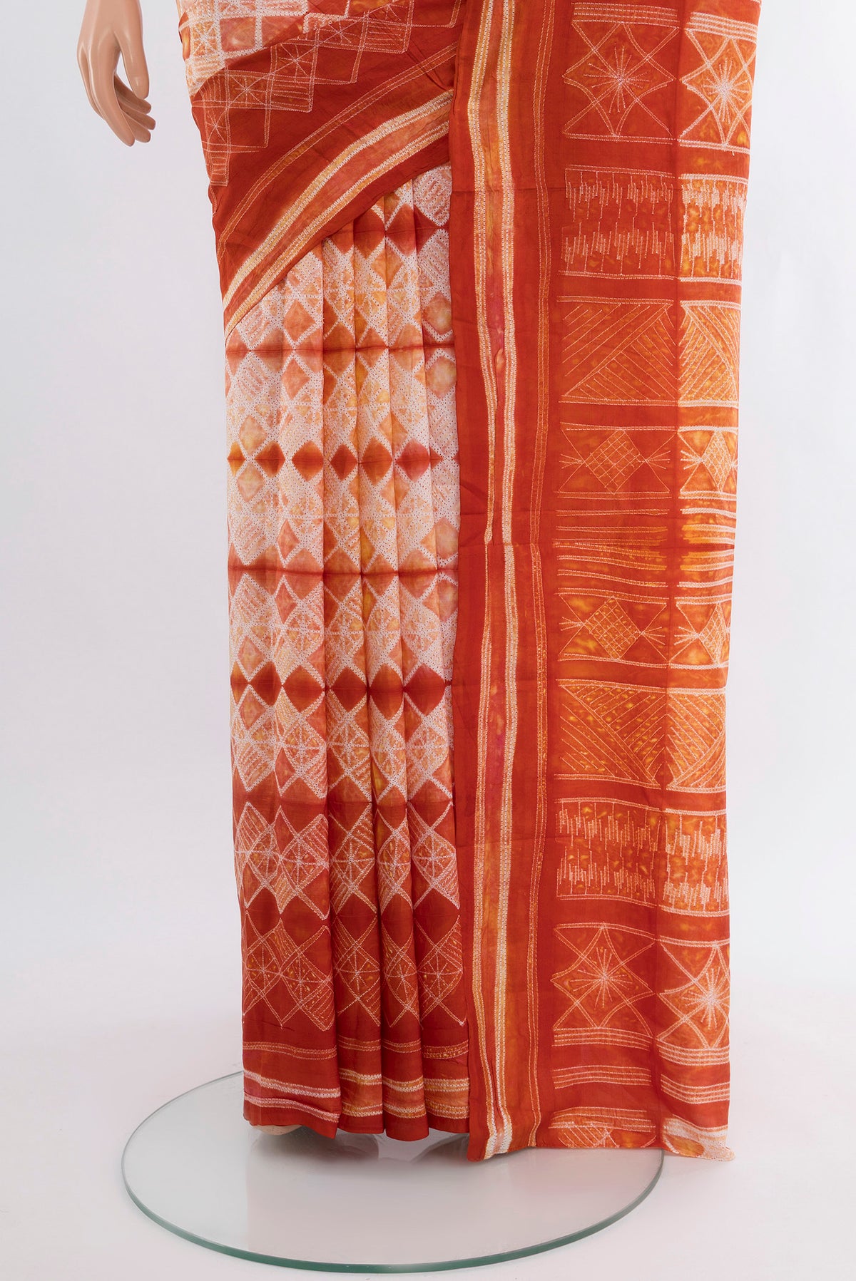 Pleats and pallu of Cream Tussar Silk Saree with Floral Print on the body and Printed Border. 