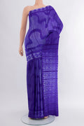 Violet Tussar Silk Saree with Floral Print on the body and Printed Border.  displayed on a mannequin