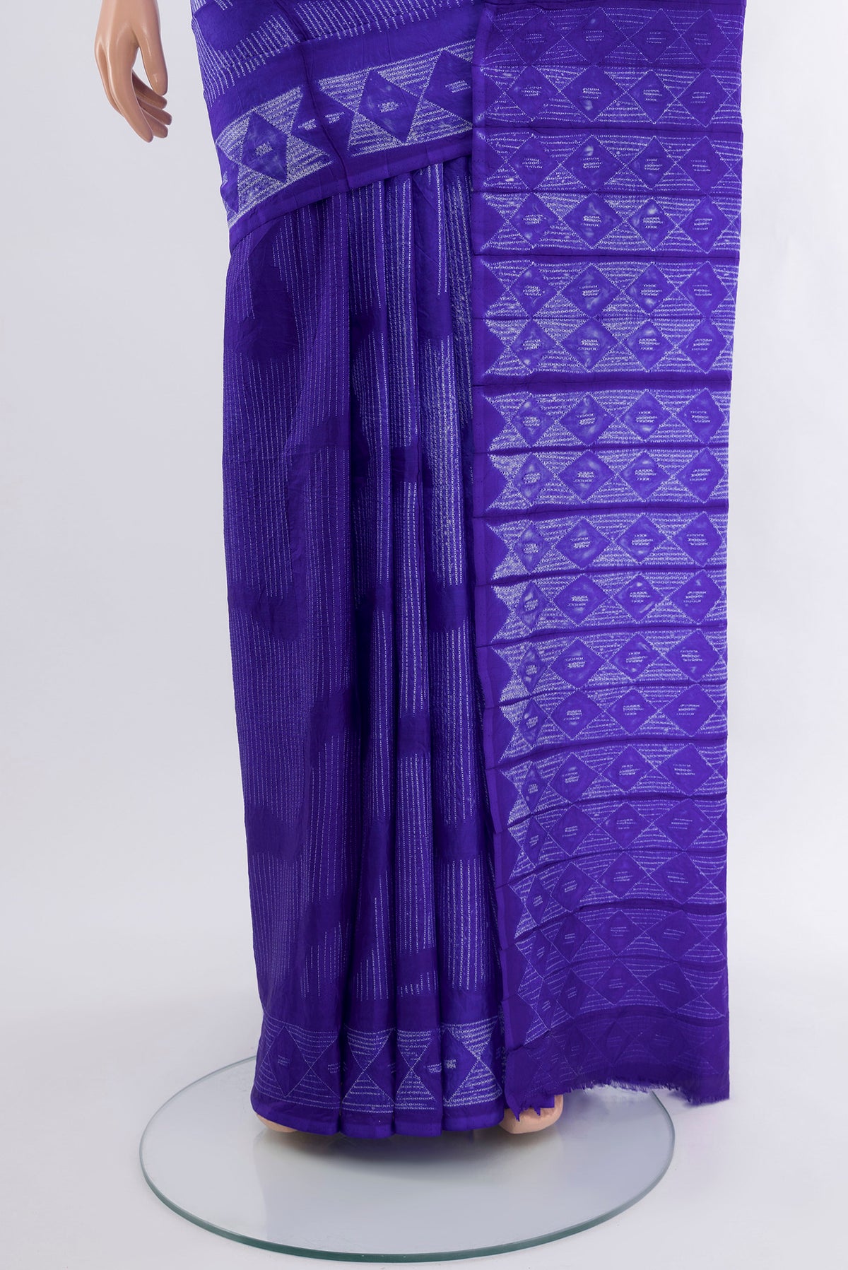 Pleats and pallu of Violet Tussar Silk Saree with Floral Print on the body and Printed Border. 