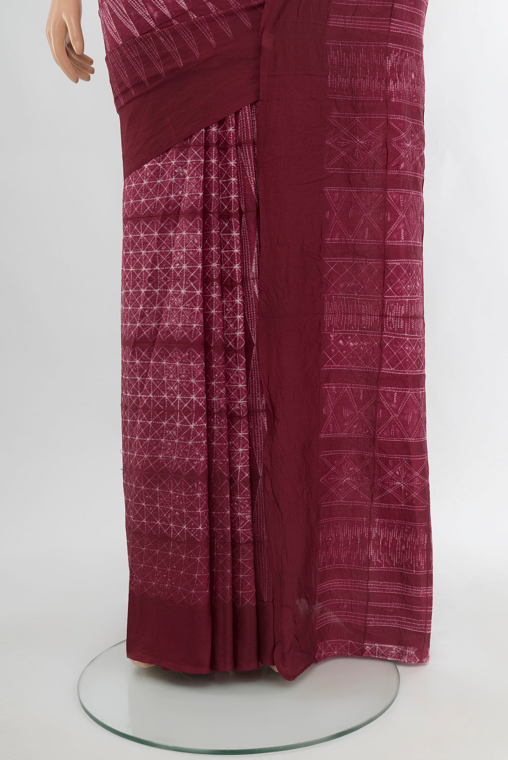 Pleats and pallu of Maroon Tussar Silk Saree with Floral Print on the body and Plain Border. 