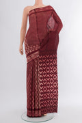Coffee Brown Tussar Silk Saree with Floral Print on the body and Printed Border.  displayed on a mannequin