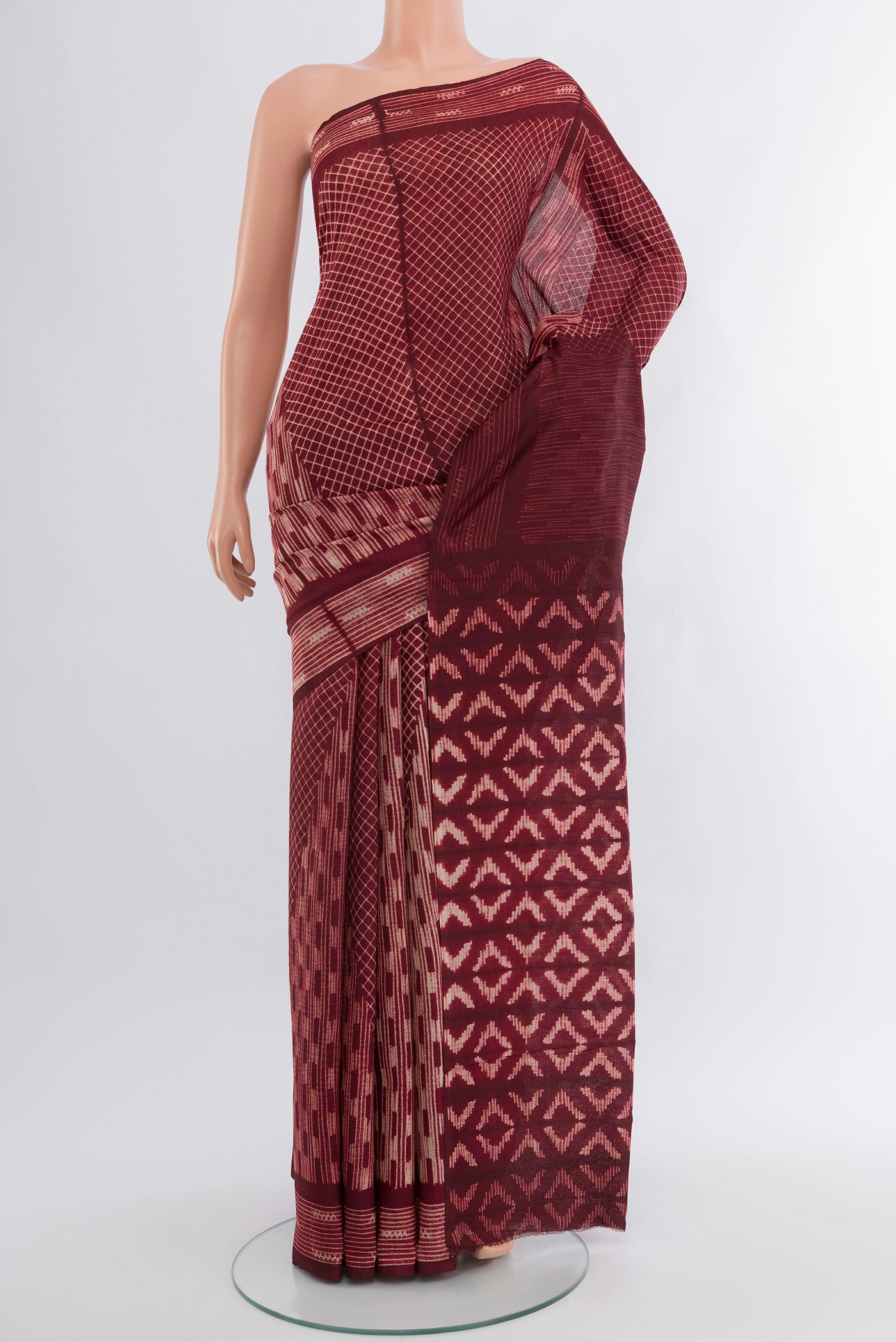 Coffee Brown Tussar Silk Saree with Floral Print on the body and Printed Border.  displayed on a mannequin