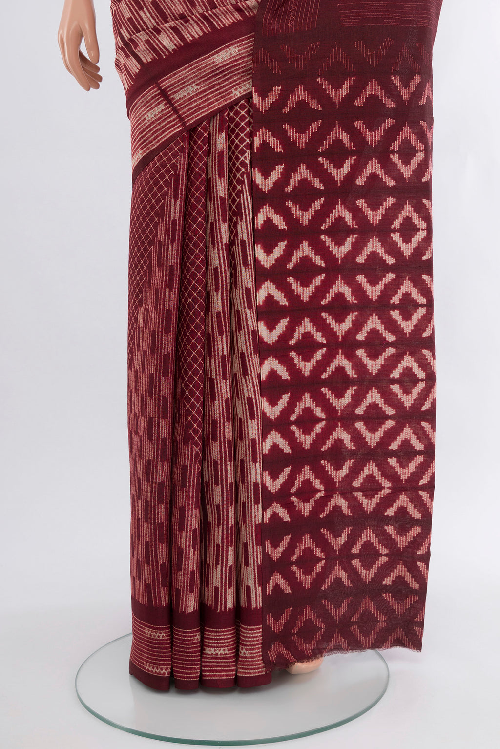 Pleats and pallu of Coffee Brown Tussar Silk Saree with Floral Print on the body and Printed Border. 