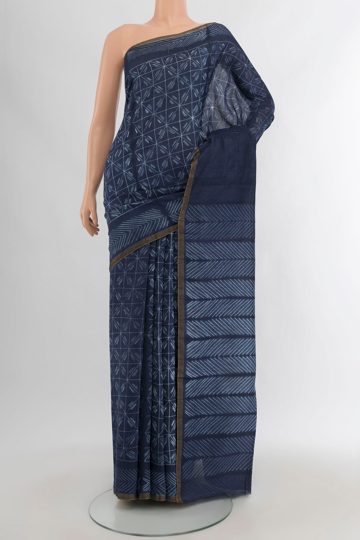 Navy Blue Tussar Silk Saree with Printed design on the body and Printed Border.  displayed on a mannequin