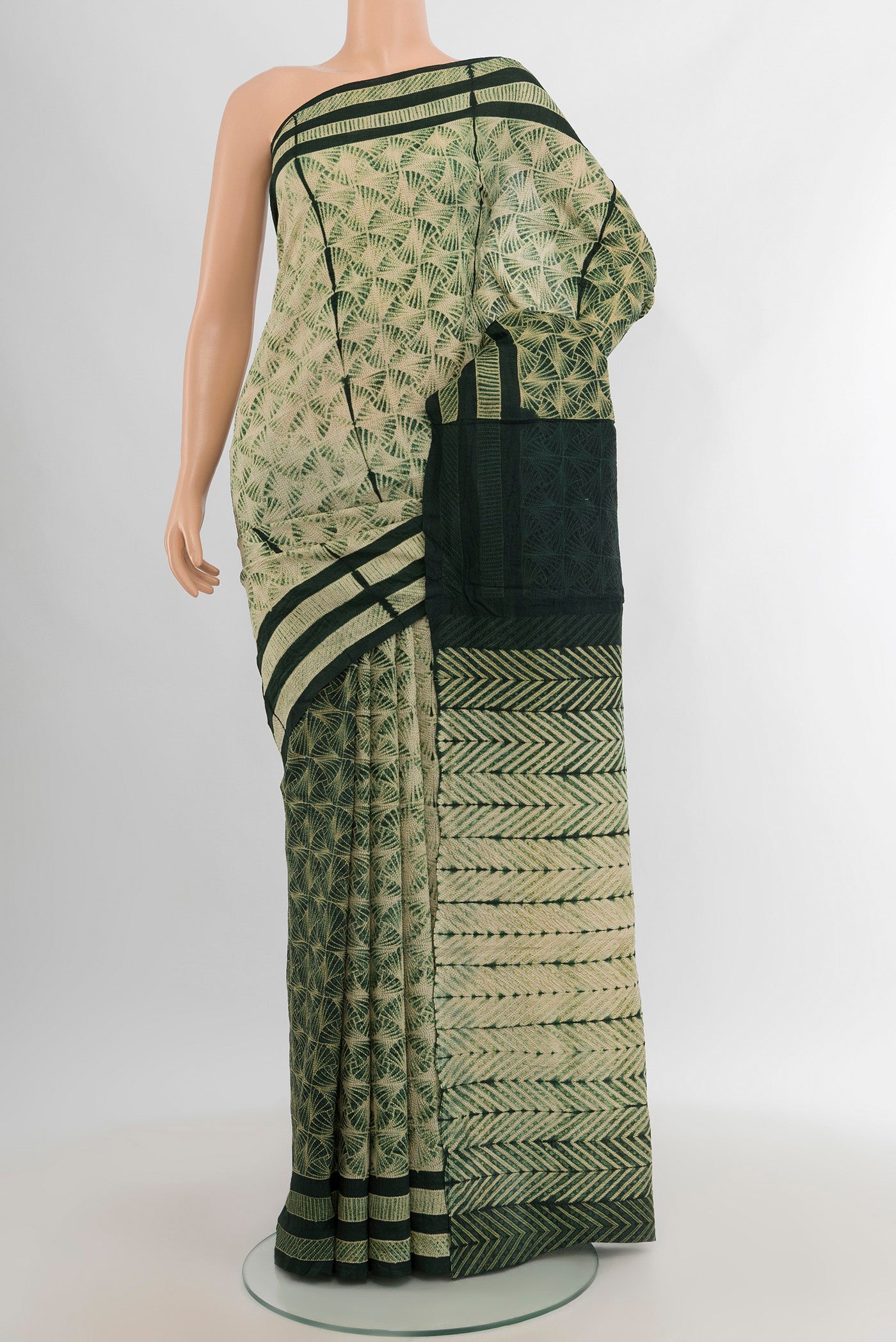 Cream Tussar Silk Saree with Floral Print on the body and Printed Border.  displayed on a mannequin