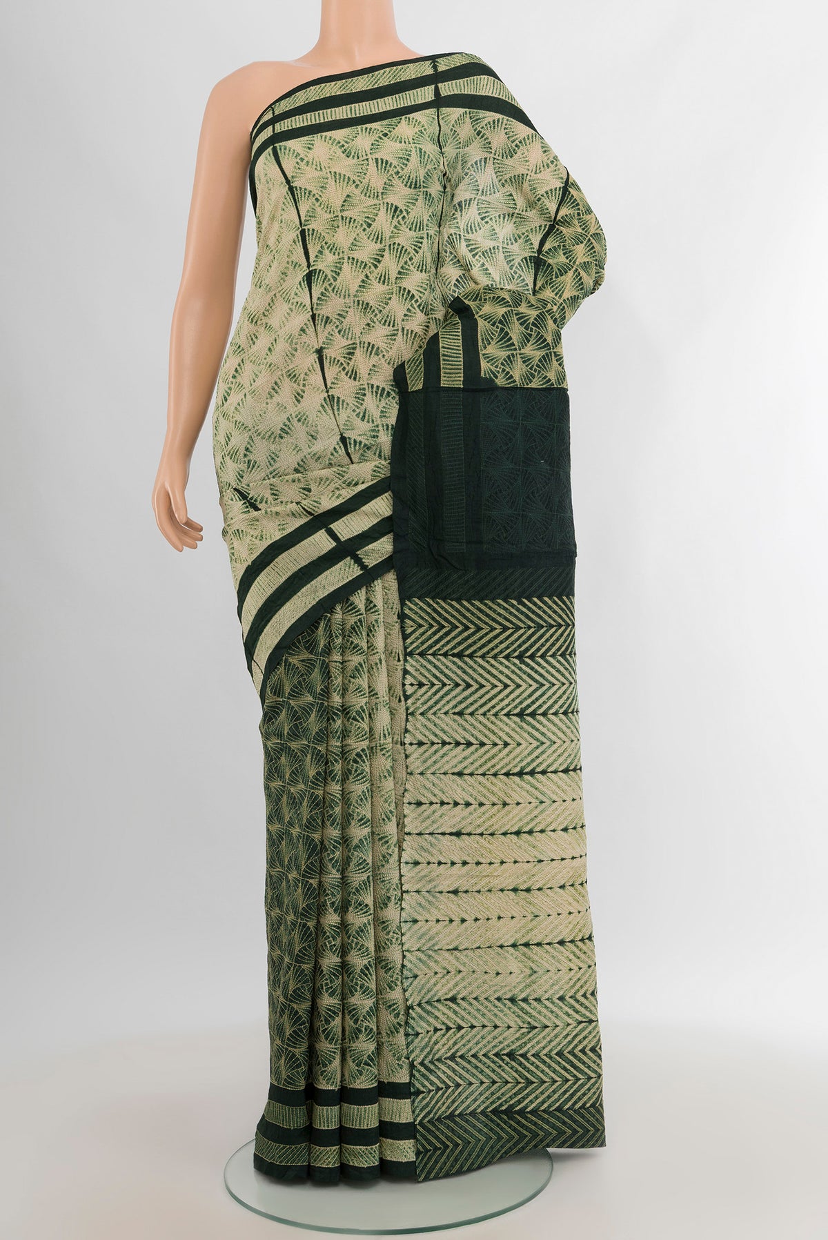 Cream Tussar Silk Saree with Floral Print on the body and Printed Border.  displayed on a mannequin