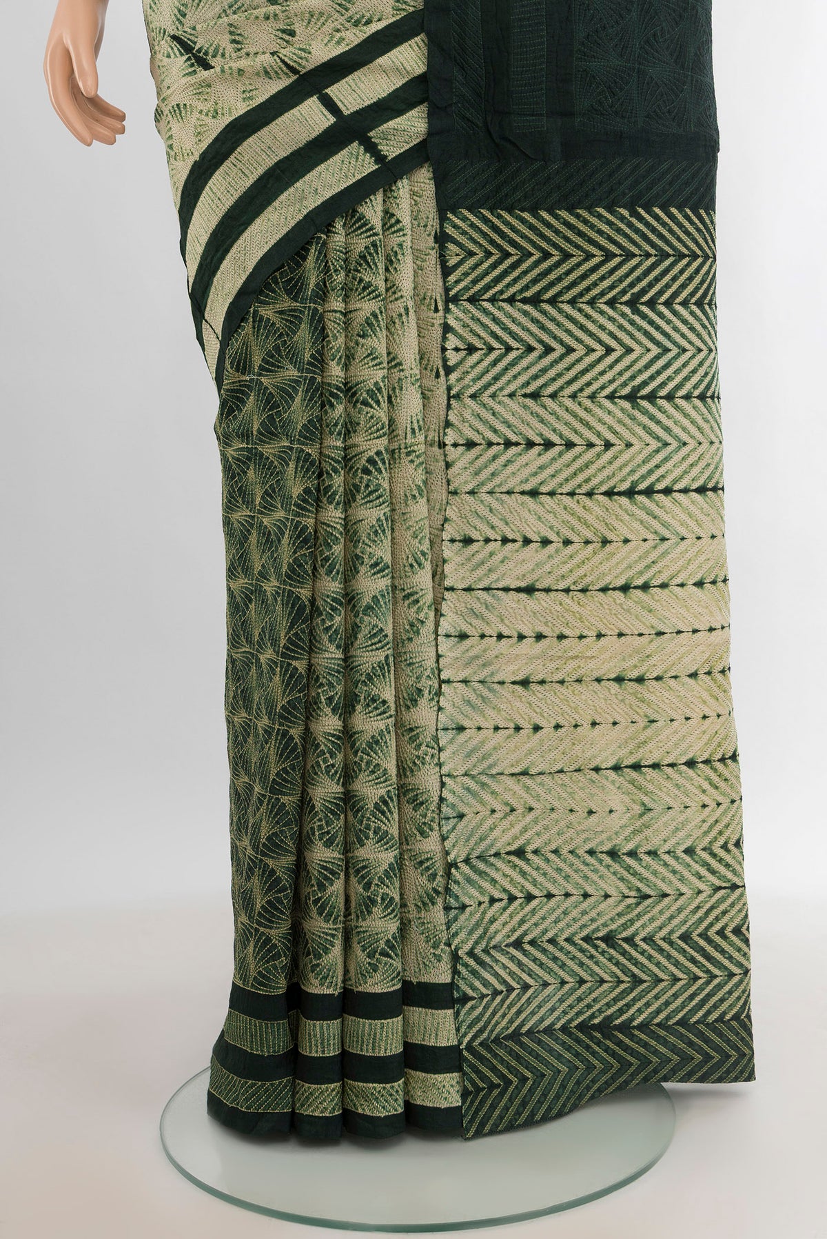 Pleats and pallu of Cream Tussar Silk Saree with Floral Print on the body and Printed Border. 