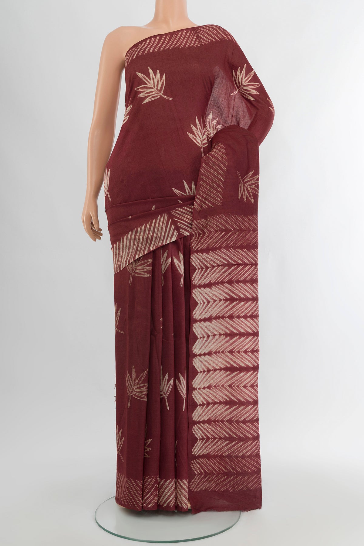 Coffee Brown Tussar Silk Saree with Floral Print on the body and Printed Border.  displayed on a mannequin