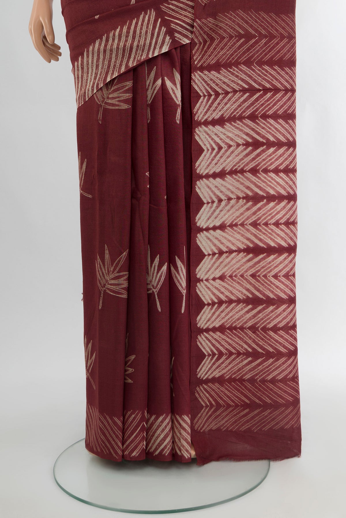 Pleats and pallu of Coffee Brown Tussar Silk Saree with Floral Print on the body and Printed Border. 