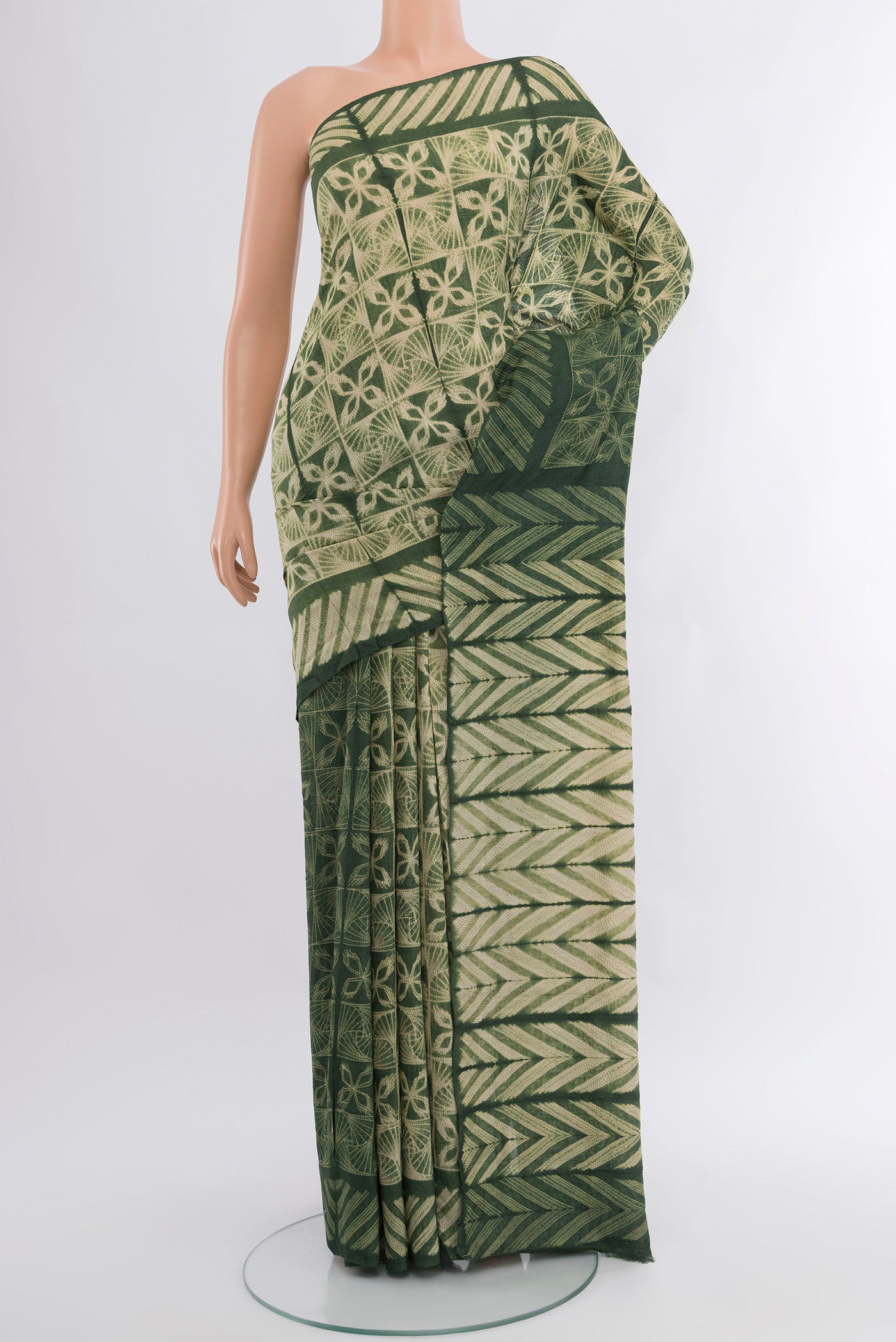 Beige Tussar Silk Saree with Floral Print on the body and Printed Border.  displayed on a mannequin