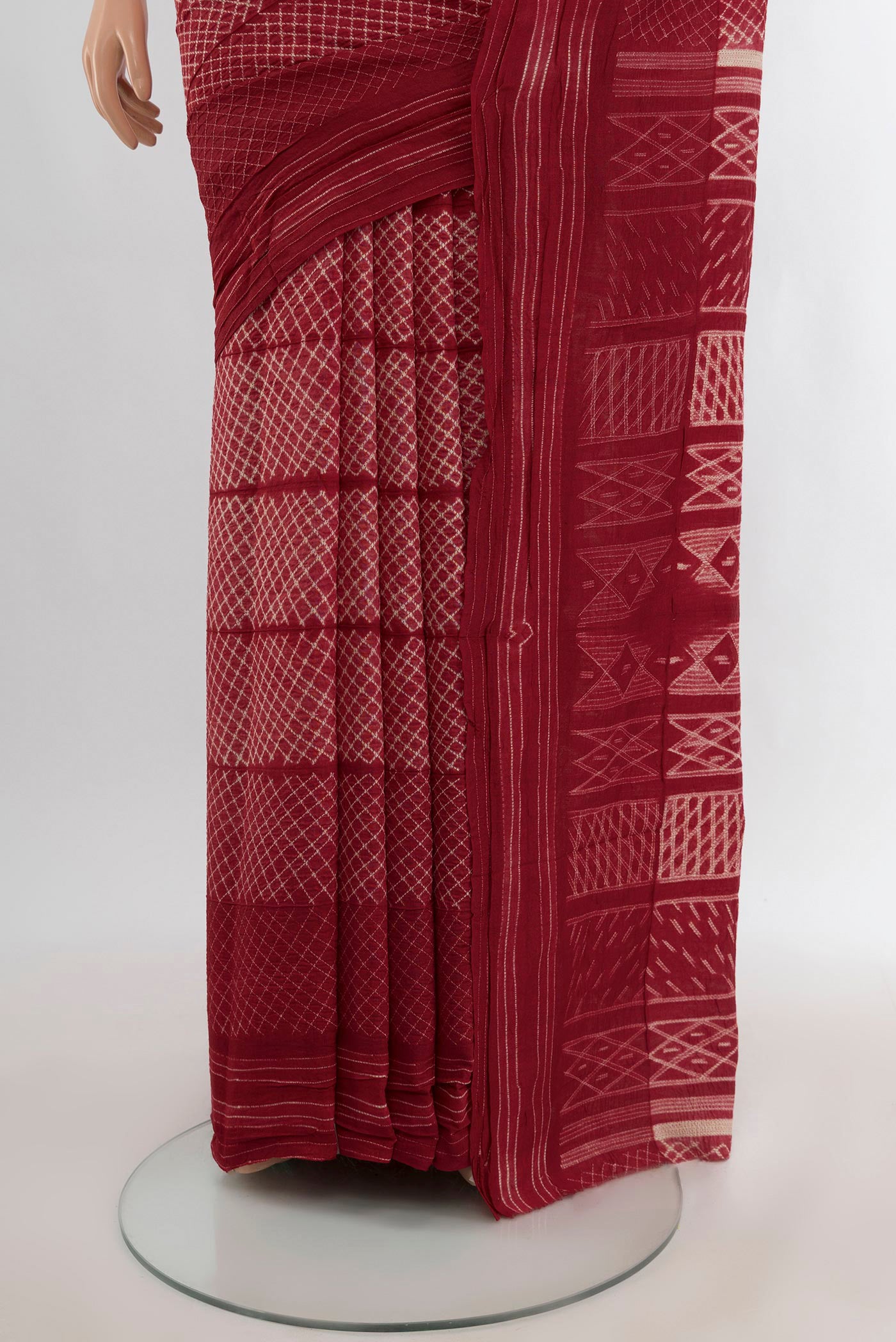 Pleats and pallu of Maroon Tussar Silk Nine Yards Saree with Printed design on the body and Plain Border. 