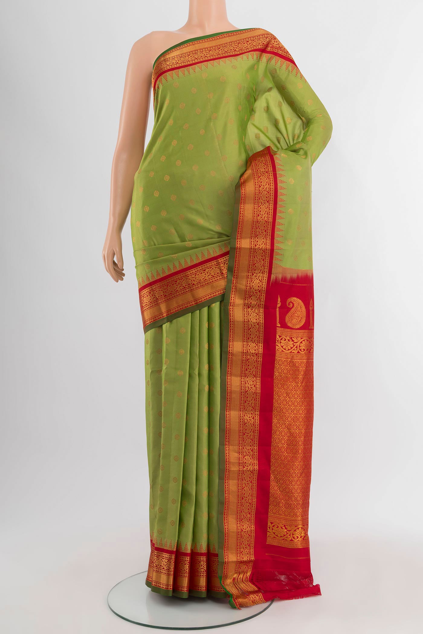 Light Green Gadwal Silk Saree with Zari Butta on the body and Zari Border.  displayed on a mannequin