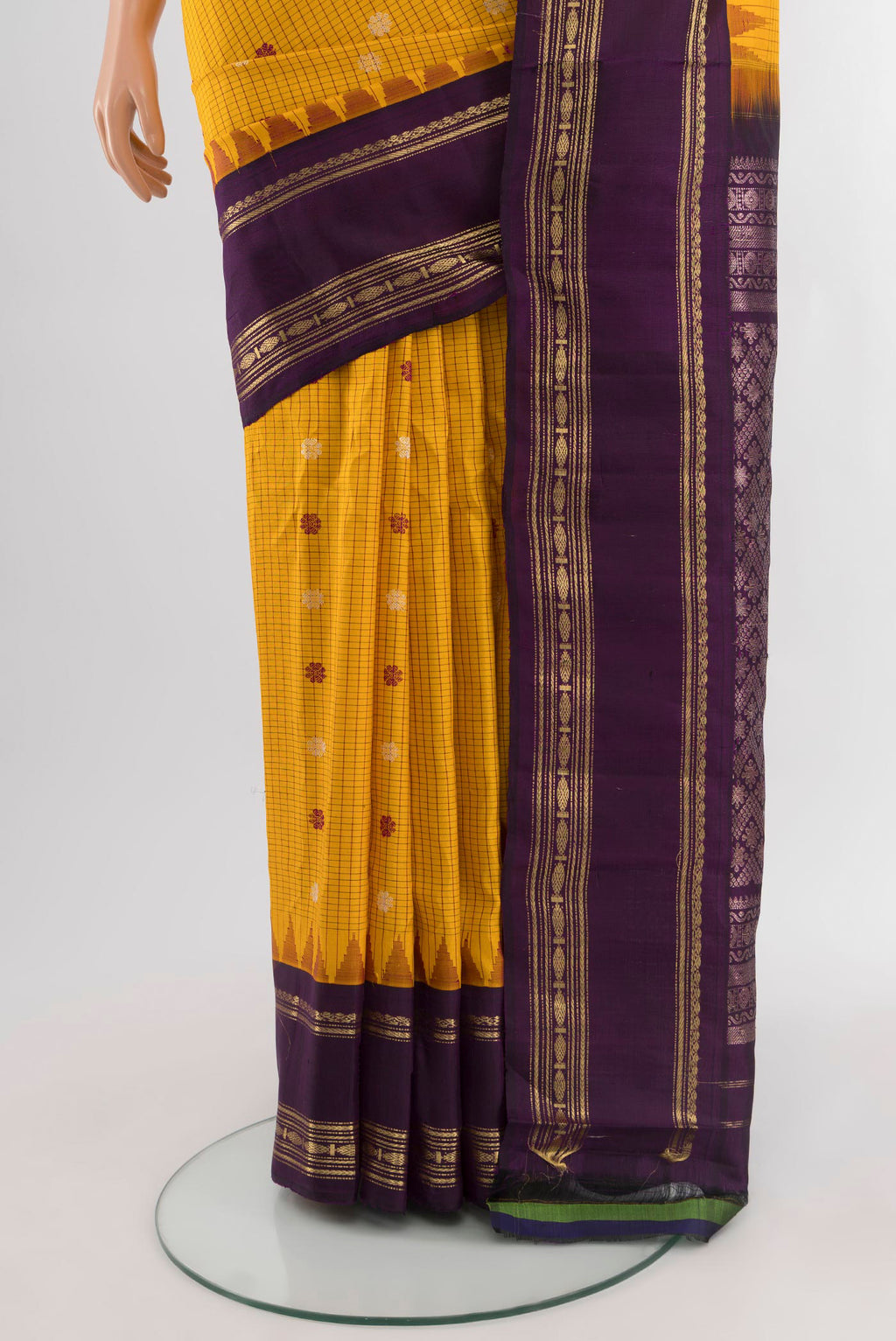 Pleats and pallu of Yellow Gadwal Silk Saree with Checked design on the body and Zari Border. 
