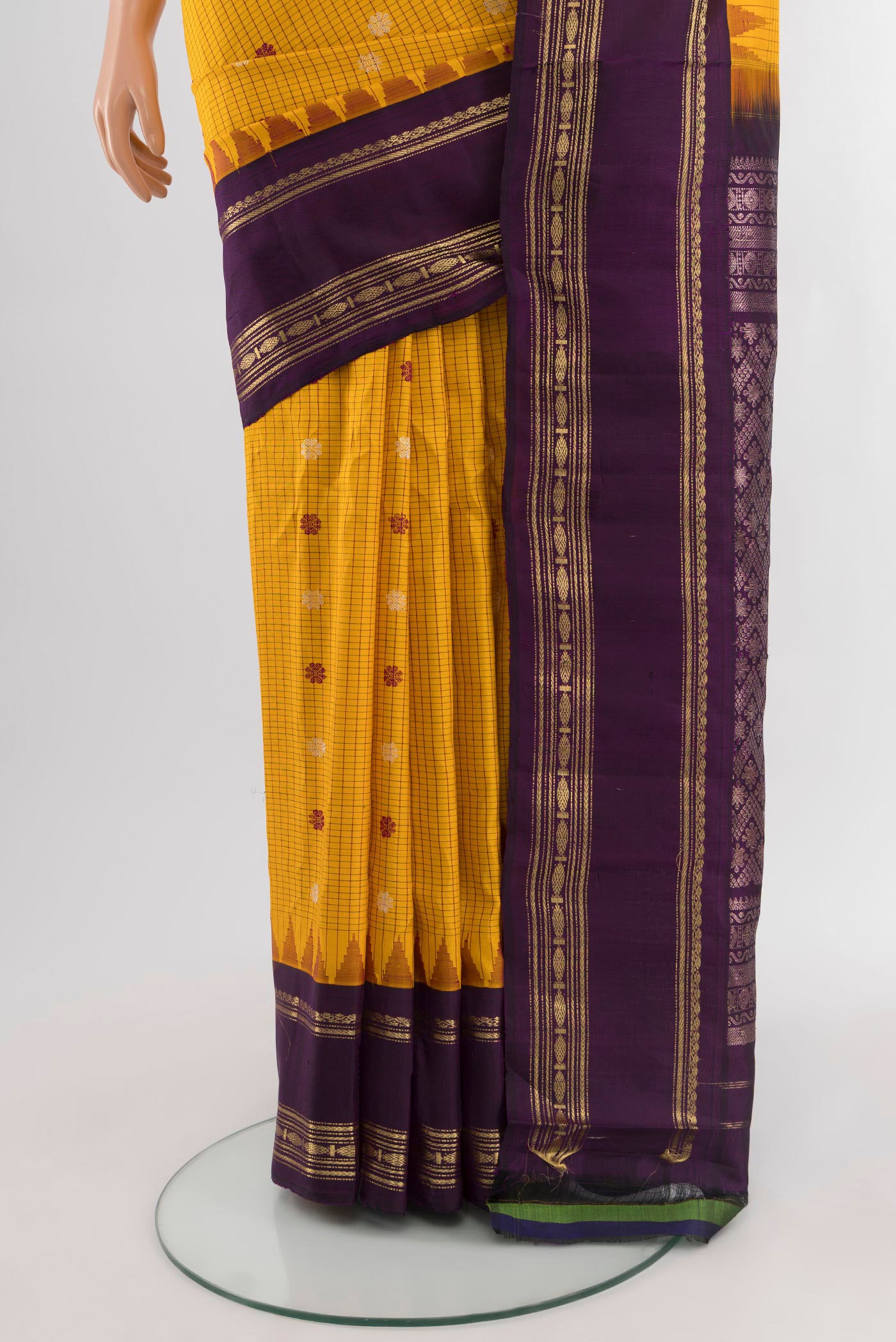 Pleats and pallu of Yellow Gadwal Silk Saree with Checked design on the body and Zari Border. 