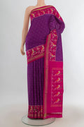 Pure Silk Purple Pochampally Saree with Pure Ikat on the body and Ikat Border.  displayed on a mannequin