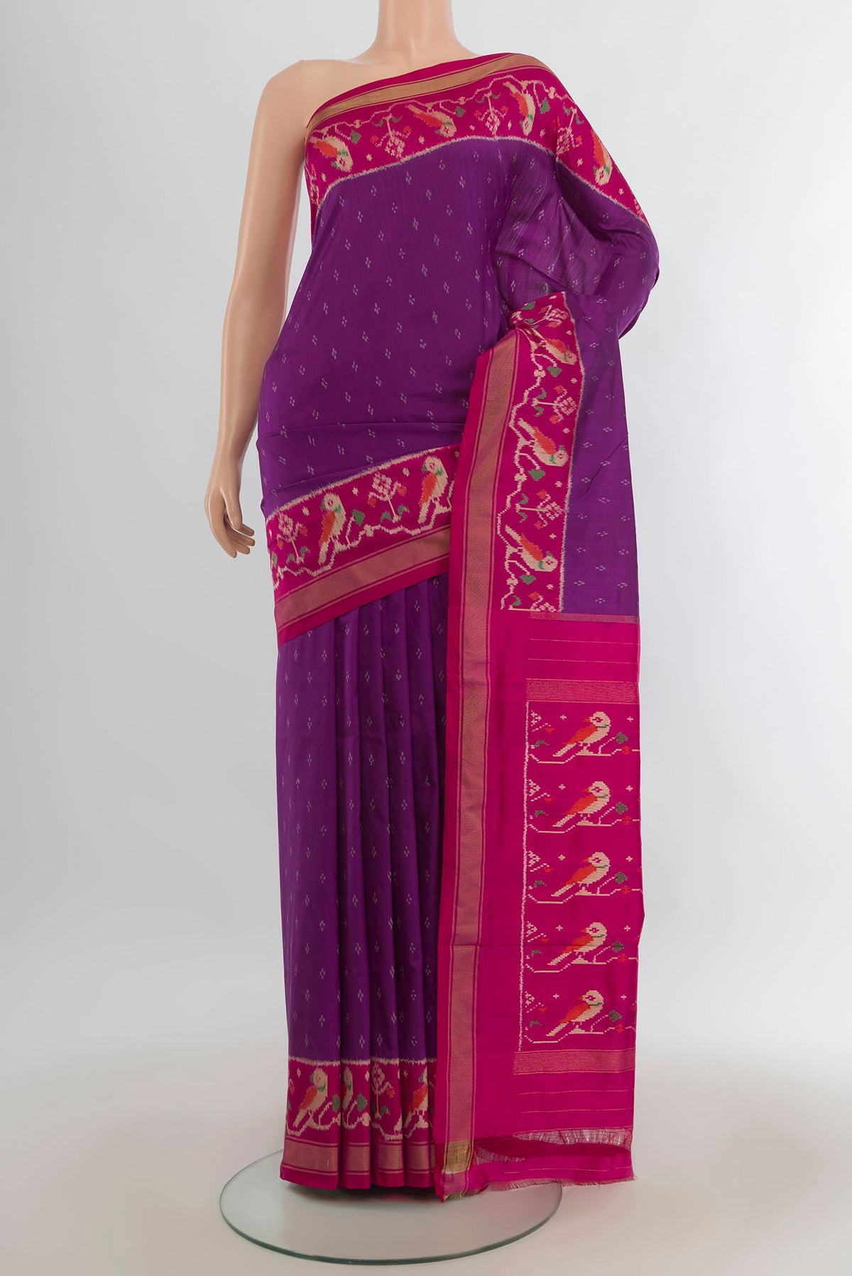 Pure Silk Purple Pochampally Saree with Pure Ikat on the body and Ikat Border.  displayed on a mannequin