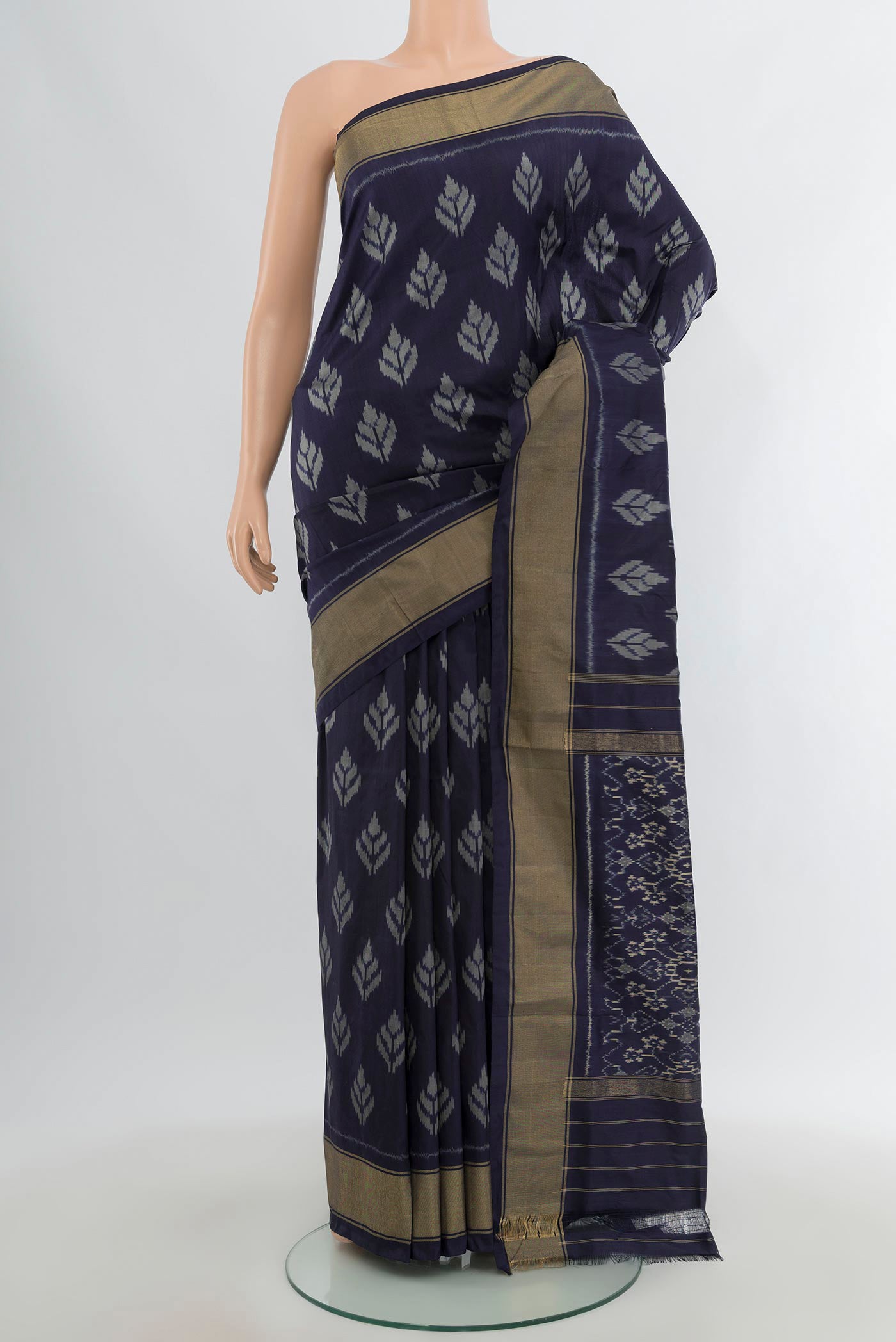 Navy Blue Pochampally Silk Saree with Pure Ikat on the body and Zari Border.  displayed on a mannequin