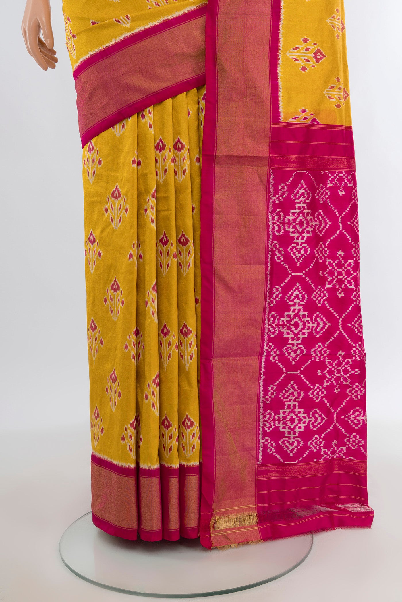 Pleats and pallu of Yellow Pochampally Silk Saree with Pure Ikat on the body and Zari Border. 
