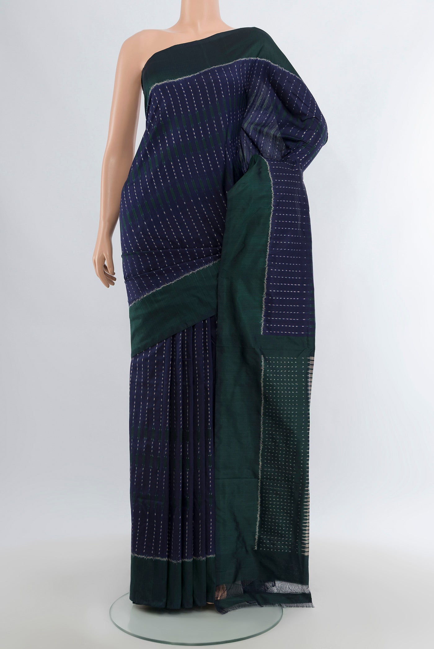 Navy Blue Pochampally Silk Saree with Pure Ikat on the body and Plain Border.  displayed on a mannequin