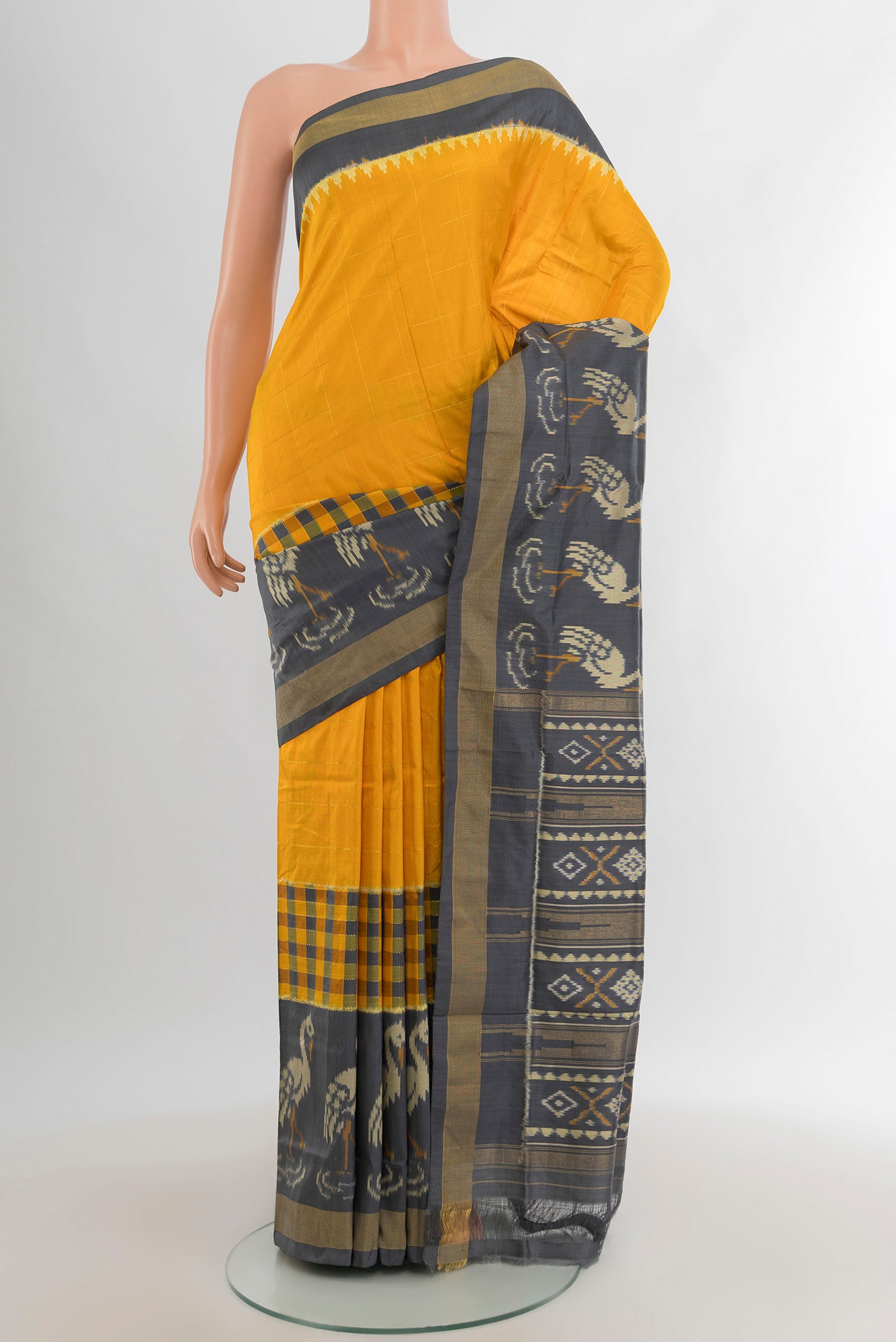 Yellow Pochampally Silk Saree with Plain Body and Zari Border.  displayed on a mannequin