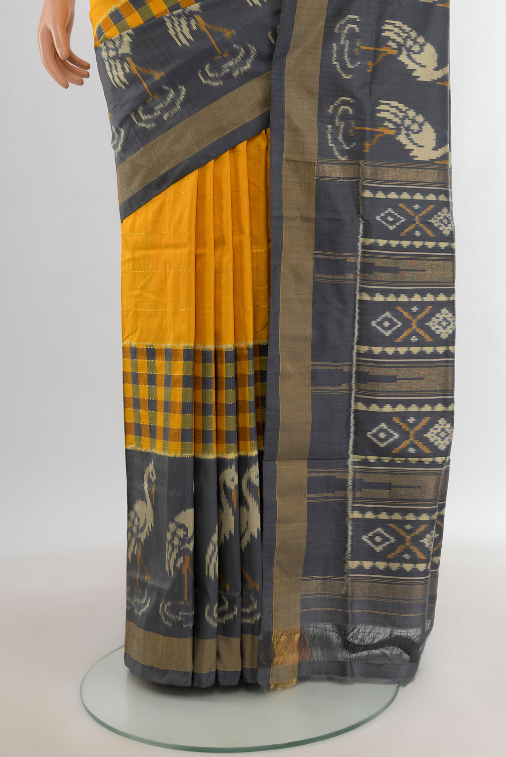 Pleats and pallu of Yellow Pochampally Silk Saree with Plain Body and Zari Border. 