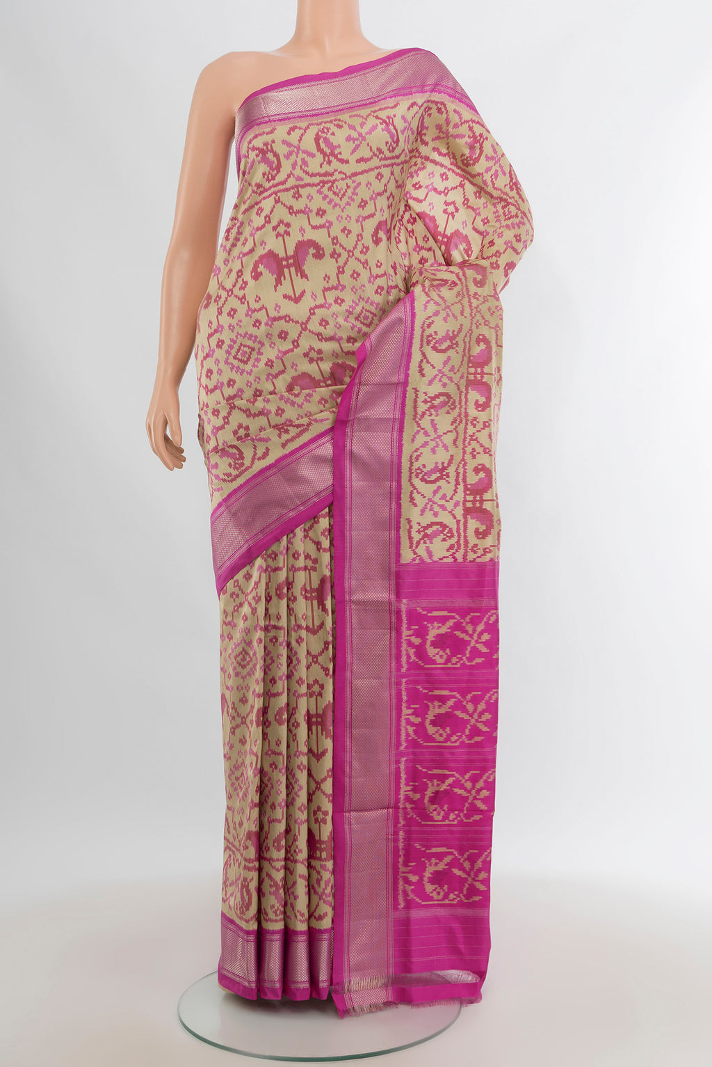 Beige Pochampally Silk Saree with Pure Ikat on the body and Zari Border.  displayed on a mannequin