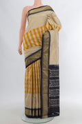 Multi Color Pochampally Silk Saree with Checked design on the body and Zari Border.  displayed on a mannequin