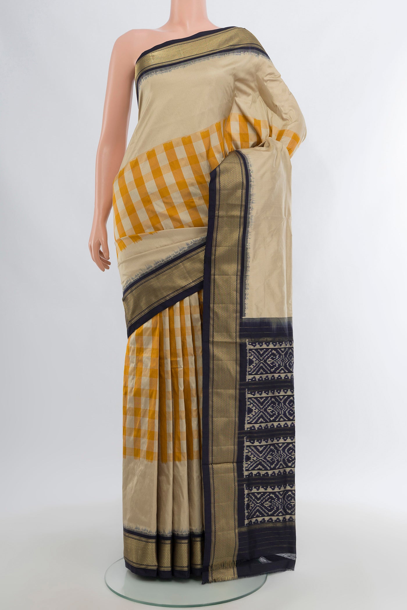 Multi Color Pochampally Silk Saree with Checked design on the body and Zari Border.  displayed on a mannequin
