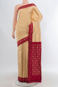 Sandal Pochampally Silk Saree with Pure Ikat on the body and Ikat Border.  displayed on a mannequin