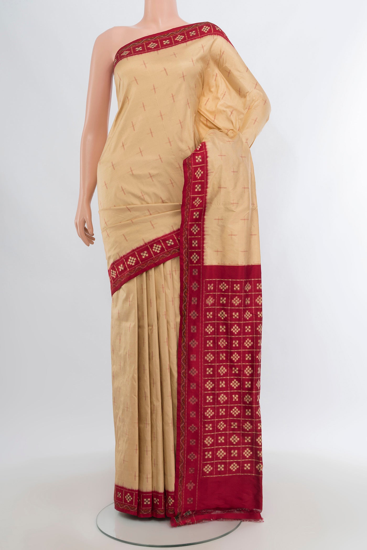 Sandal Pochampally Silk Saree with Pure Ikat on the body and Ikat Border.  displayed on a mannequin