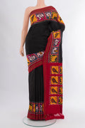 Black Pochampally Silk Saree with Plain Body and Ikat Border.  displayed on a mannequin