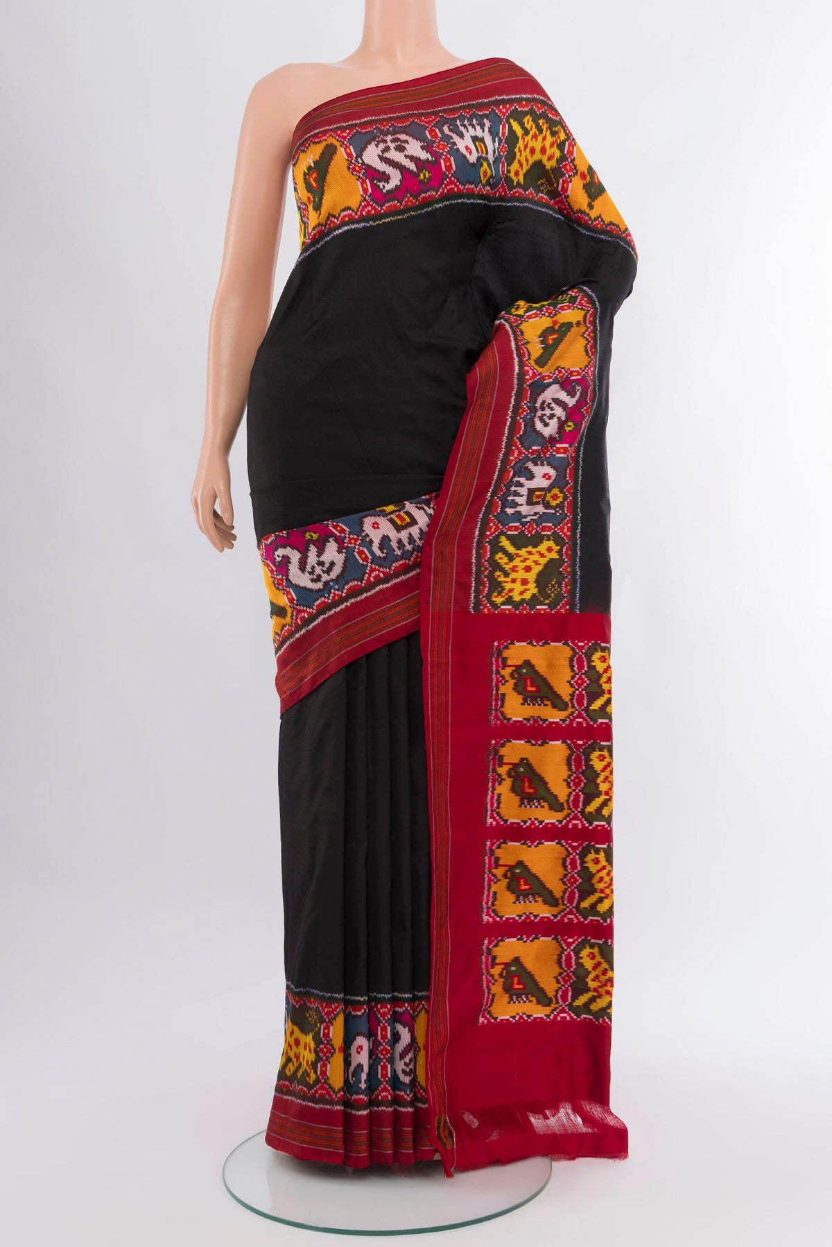 Black Pochampally Silk Saree with Plain Body and Ikat Border.  displayed on a mannequin