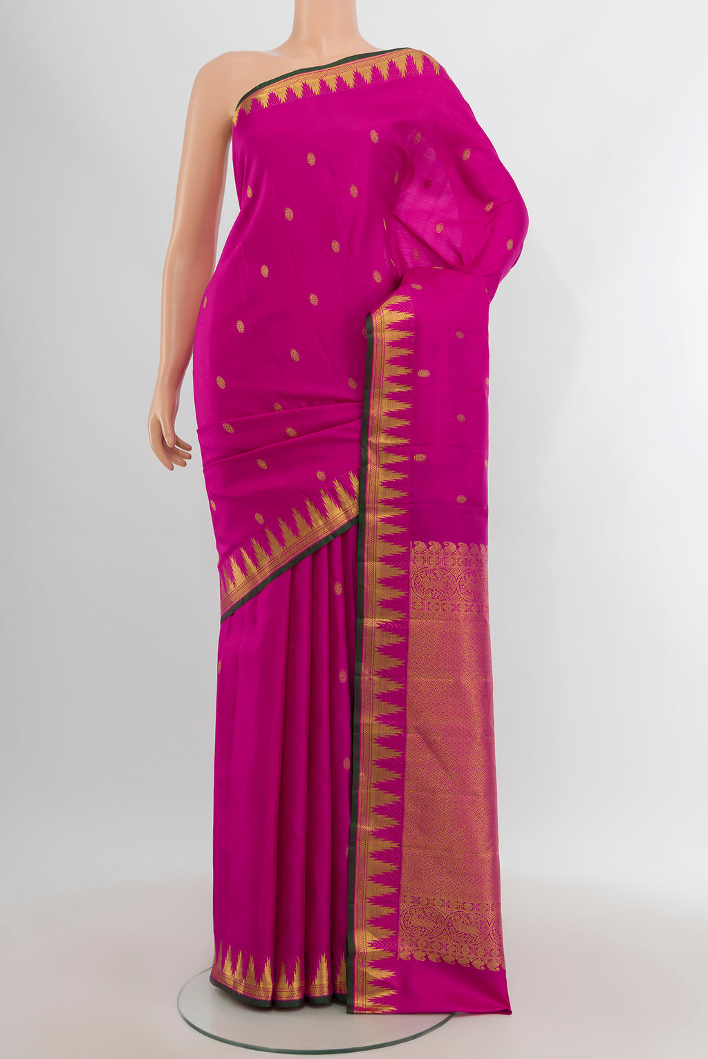 Rani Pink Kanjivaram Silk Saree with Zari Butta on the body and Zari Border.  displayed on a mannequin