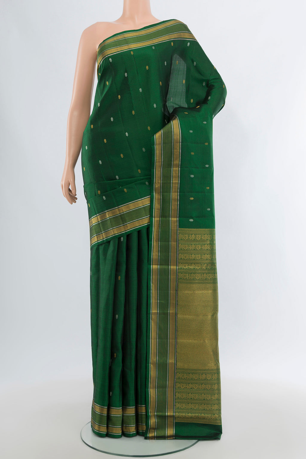 Bottle Green Kanjivaram Silk Saree with Zari Butta on the body and Zari Border.  displayed on a mannequin