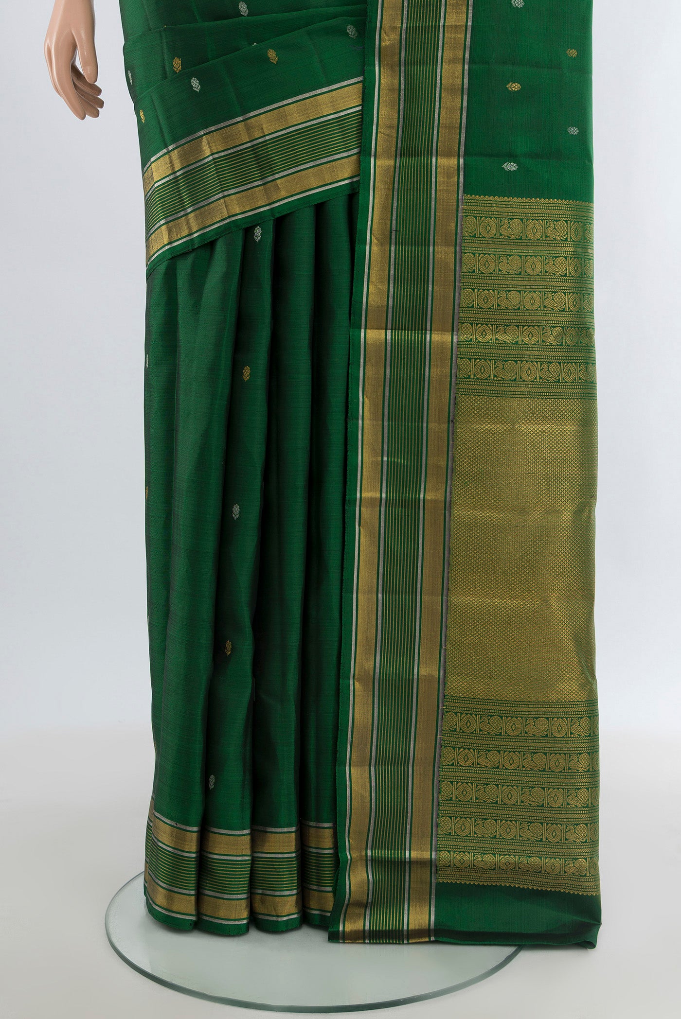 Pleats and pallu of Bottle Green Kanjivaram Silk Saree with Zari Butta on the body and Zari Border. 