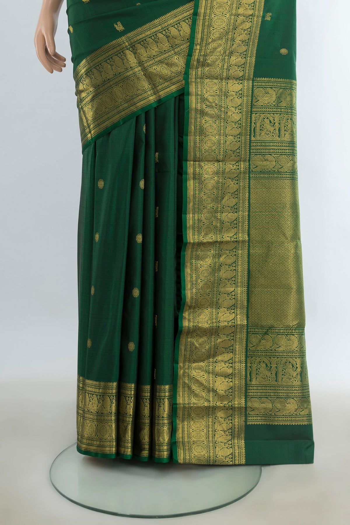 Pleats and pallu of Pure Silk Pure Zari Mint Green Kanjivaram Saree with Zari Butta on the body and Silk Border. 